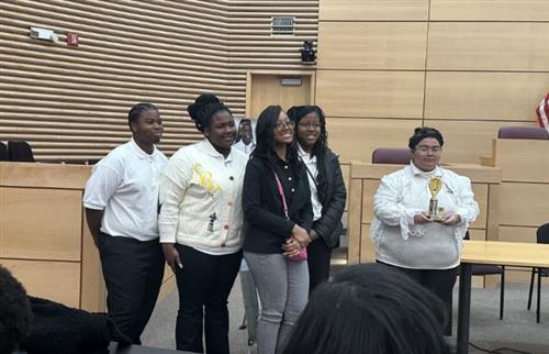  RHS Students with their 3rd place debate trophy